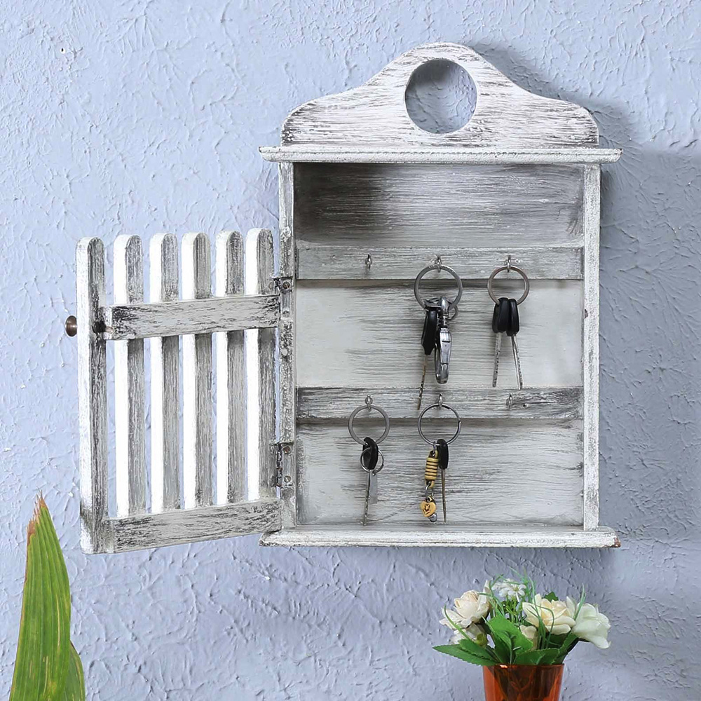 Artistic wall‑mounted key holder with multiple hooks for entryway use