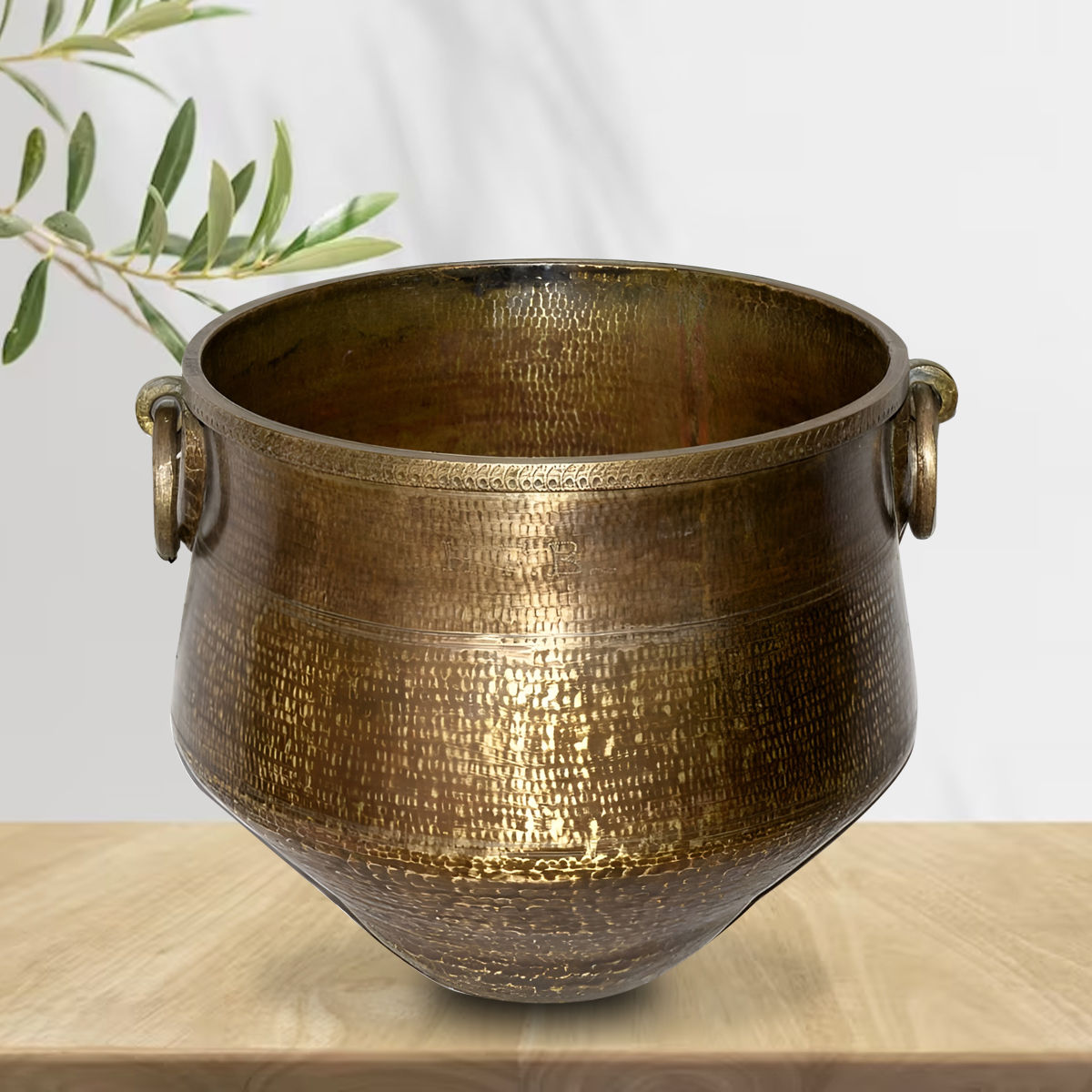 Jokubas brass pot complementing warmth for an aesthetically styled living room