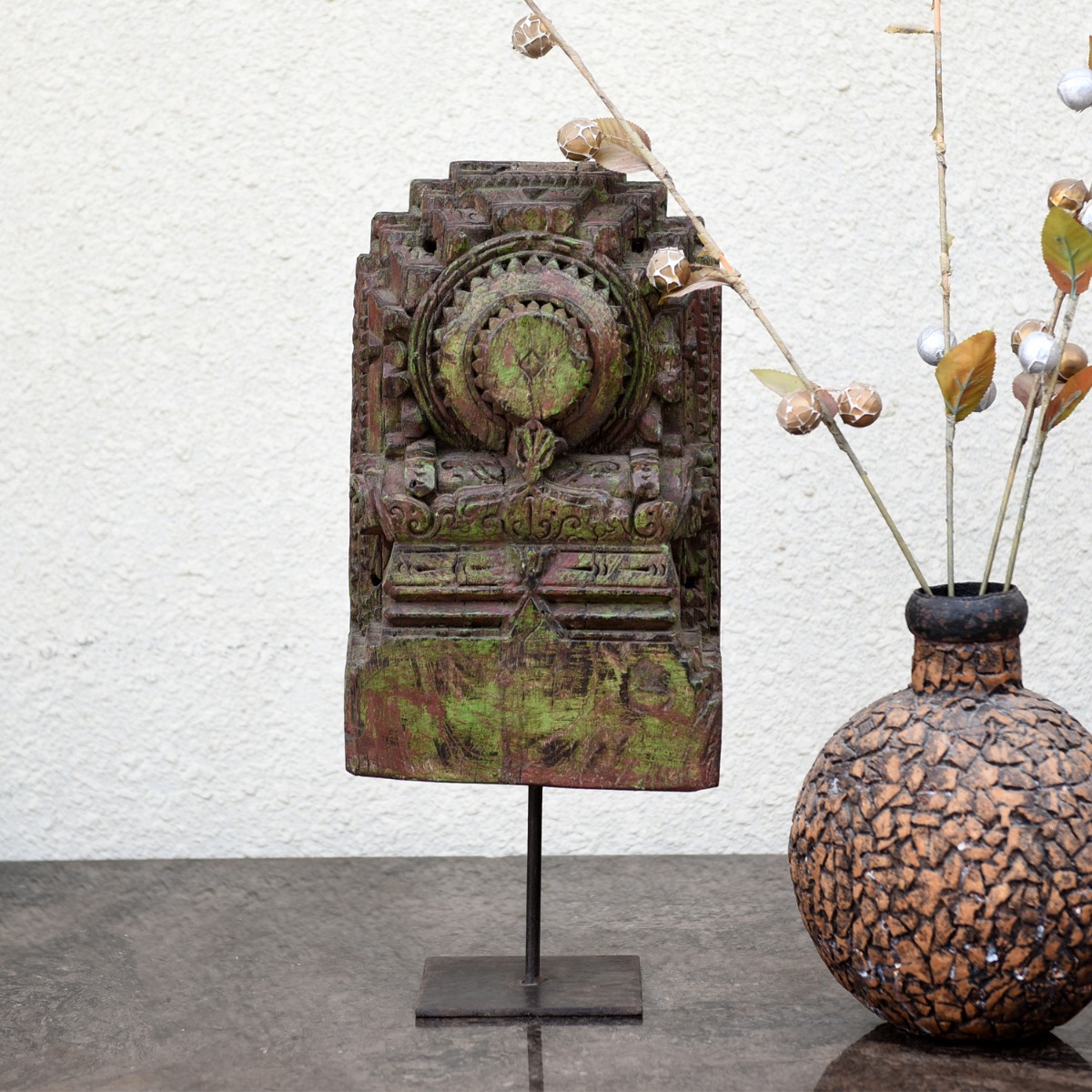 Vintage-inspired Jonas carved wooden bracket on stand styled as a decor accent