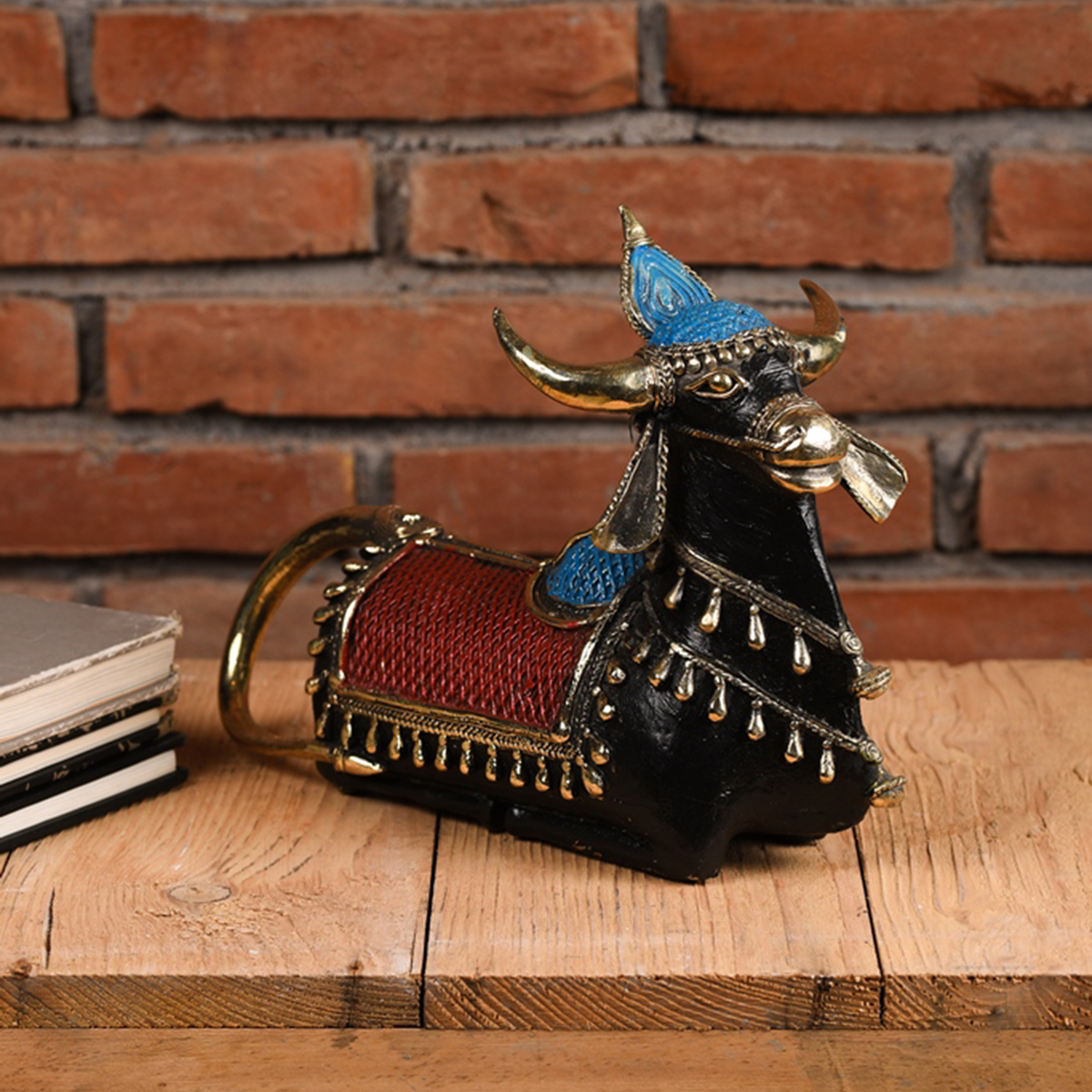 Dhokra seated Nandi brass sculpture inspired by tribal art